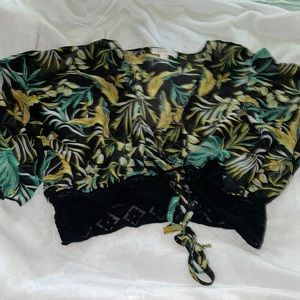 2 L Women’s blouses. Regular price $22 each. 2 for $16.